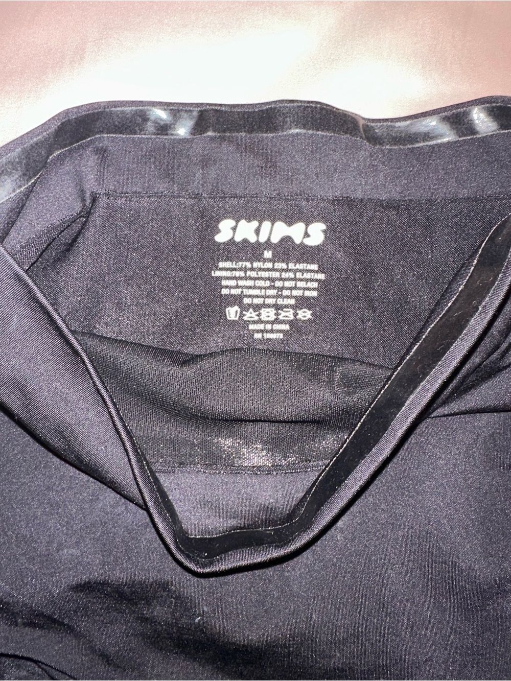 SKIMS Black Seamless Shapewear Top - Bonded Edge Detail